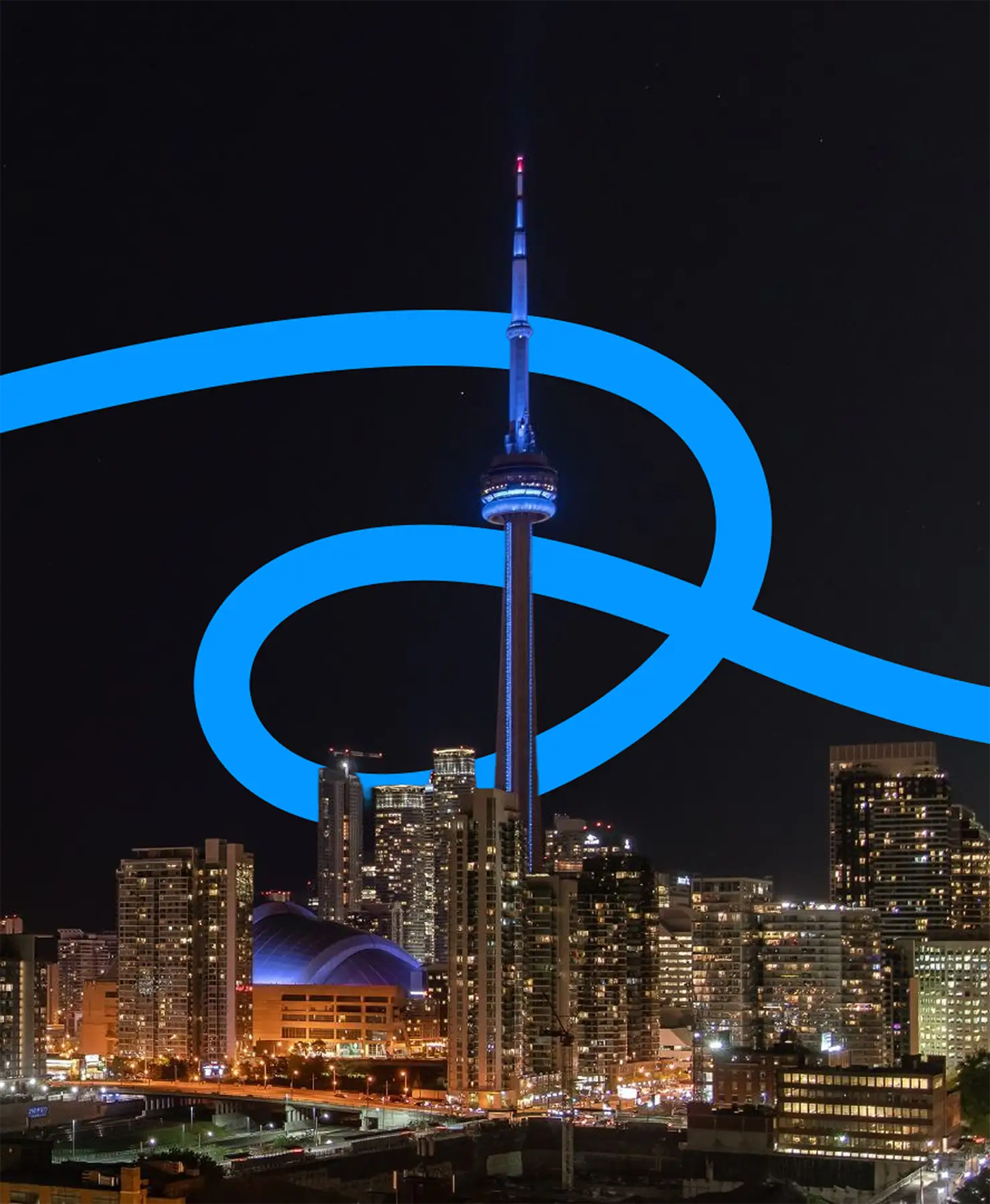 The CN Tower lit up at night above the Toronto skyline with a bright blue graphic swirl overlaid.