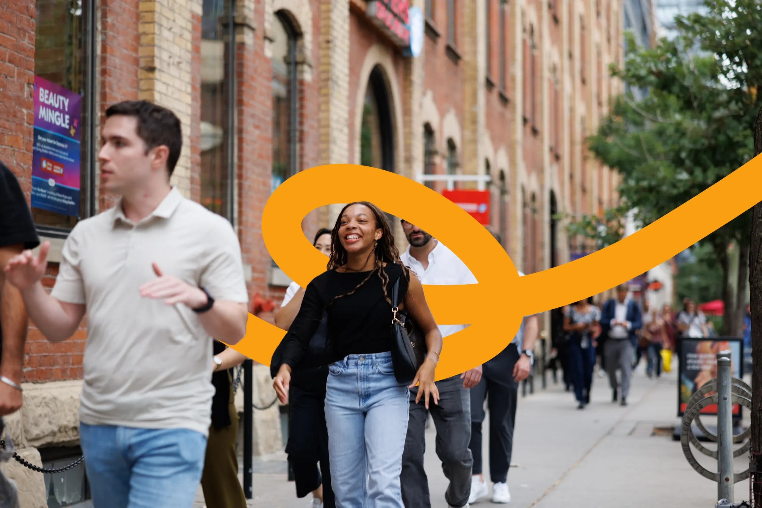 People walking on a city sidewalk with a large orange graphic swirl overlaid.